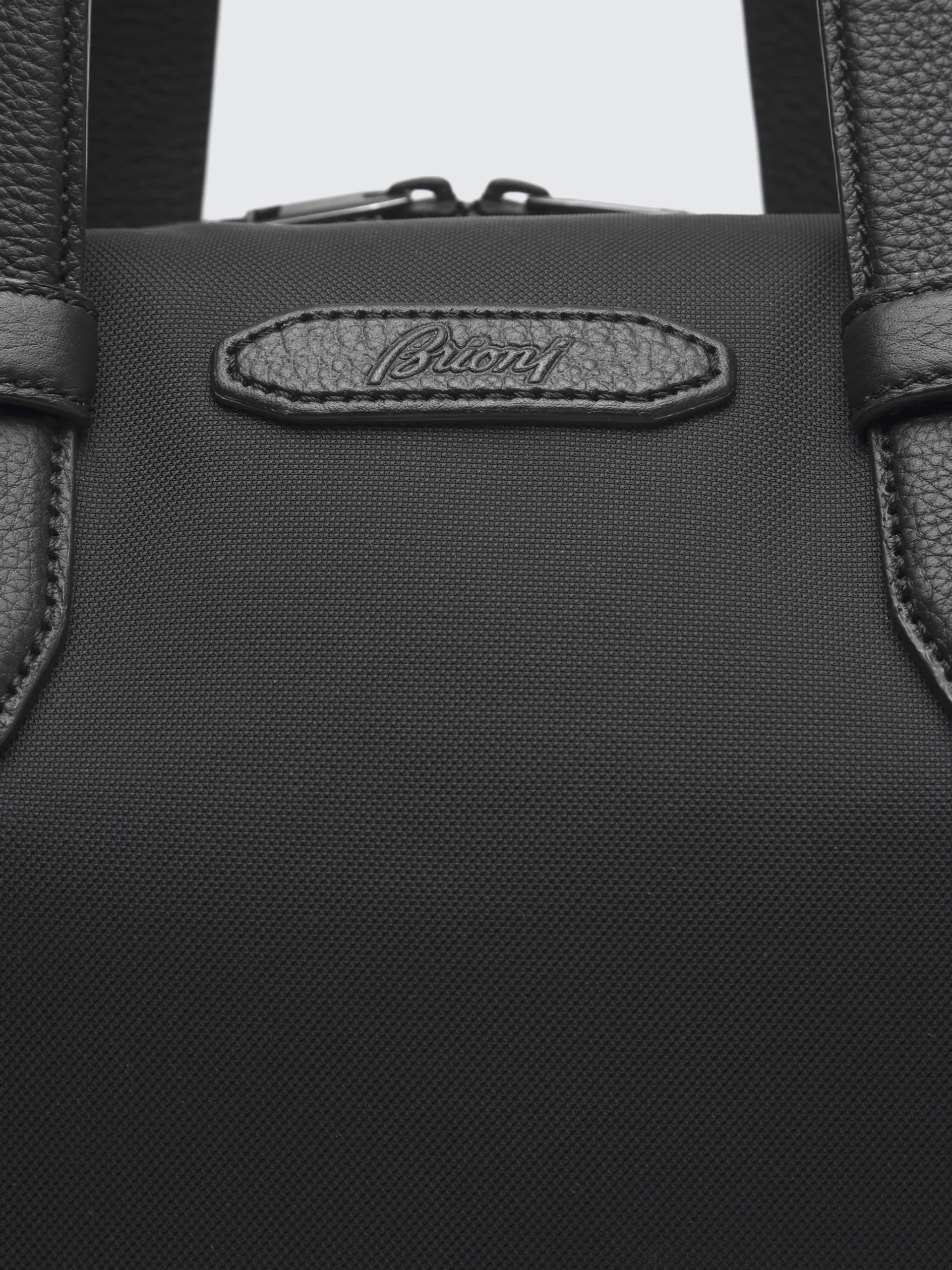 Black nylon and grained leather city bag